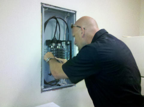 Electrician from Wendt Electric providing electrical contractor services on an electrical panel